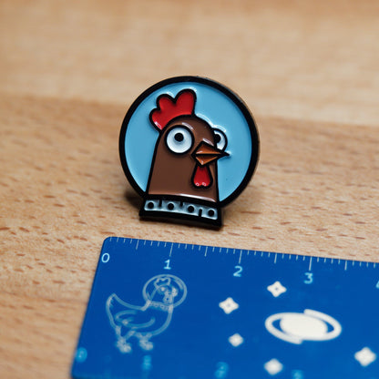 Spacehuhn Enamel Pin with ruler showing it's 22mm wide