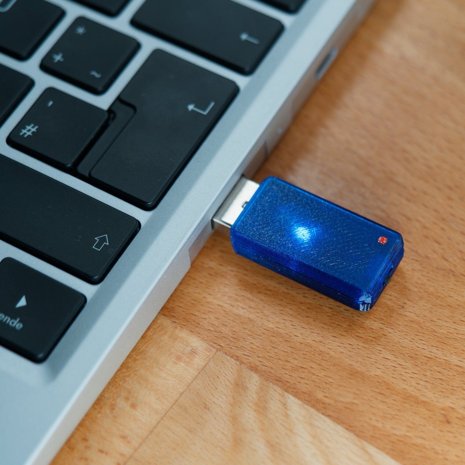 USB Nova with blue case plugged into Framework laptop